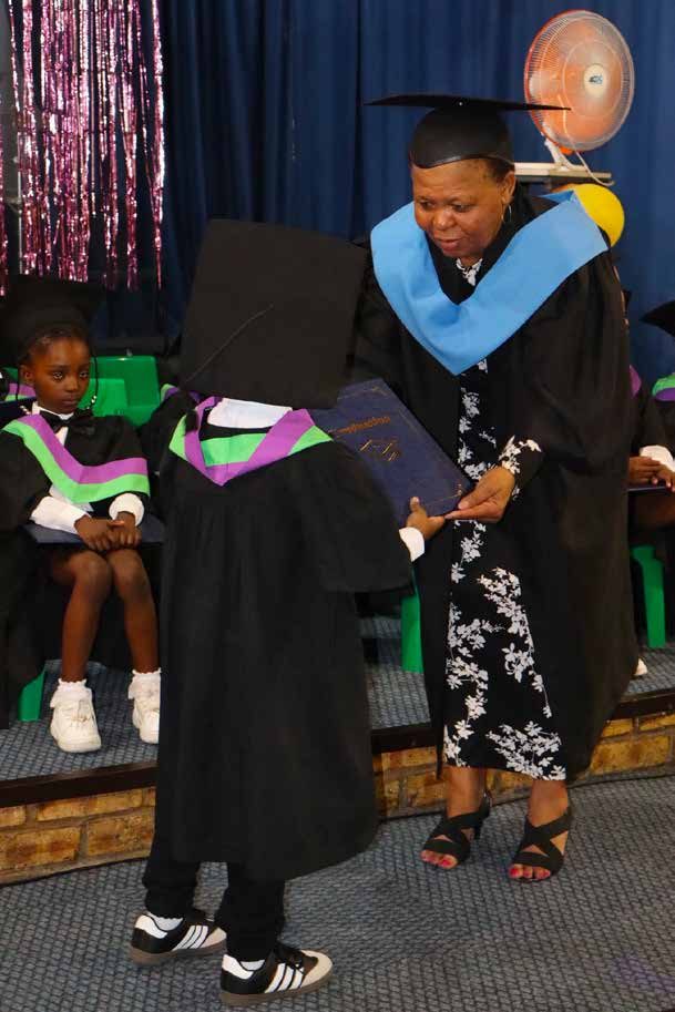 Grade R graduate receiving certificate