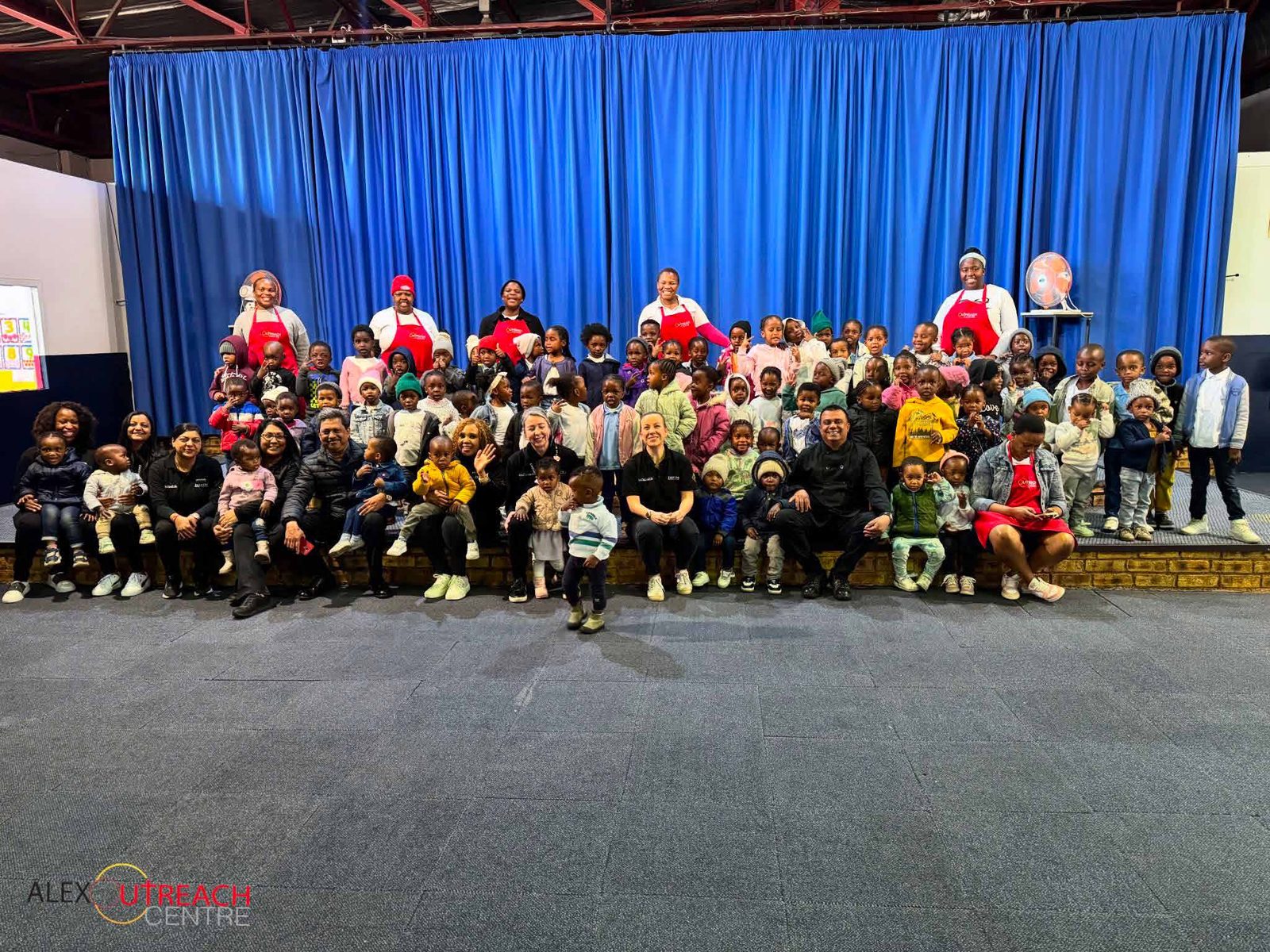 Children and teachers of Alex Outreach Centre on stage